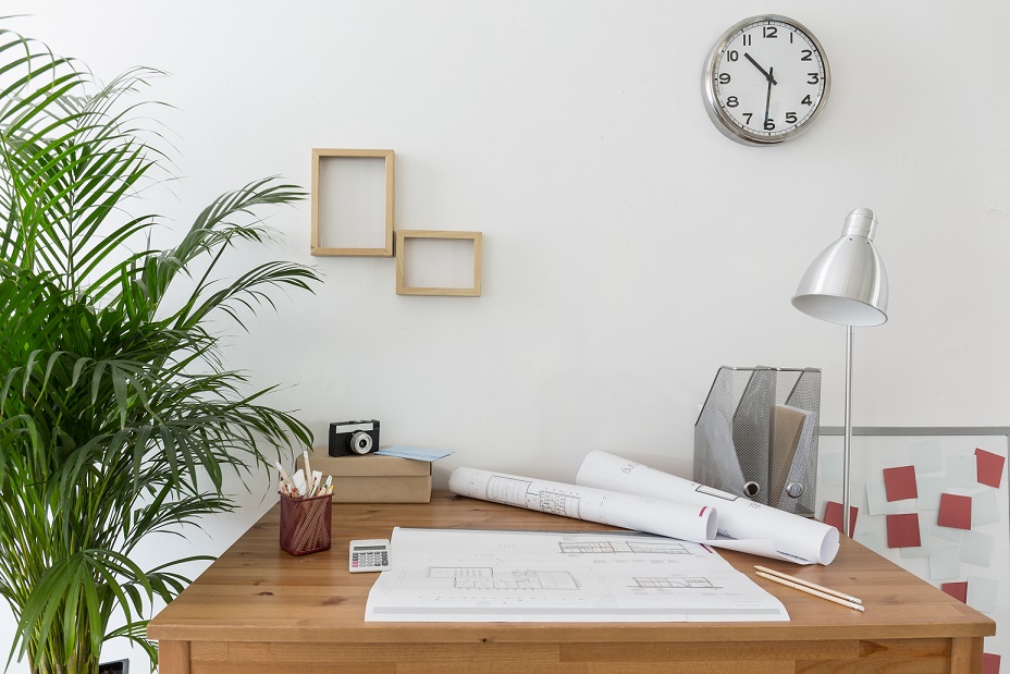 Creative space with house plans on the desk