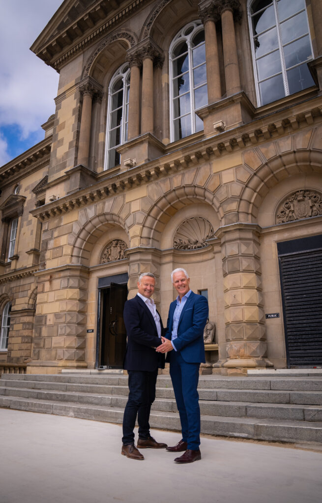 Velocity Worldwide CEO Enda McShane shaking hands with Custom House owner Neil McKibbin - Belfast